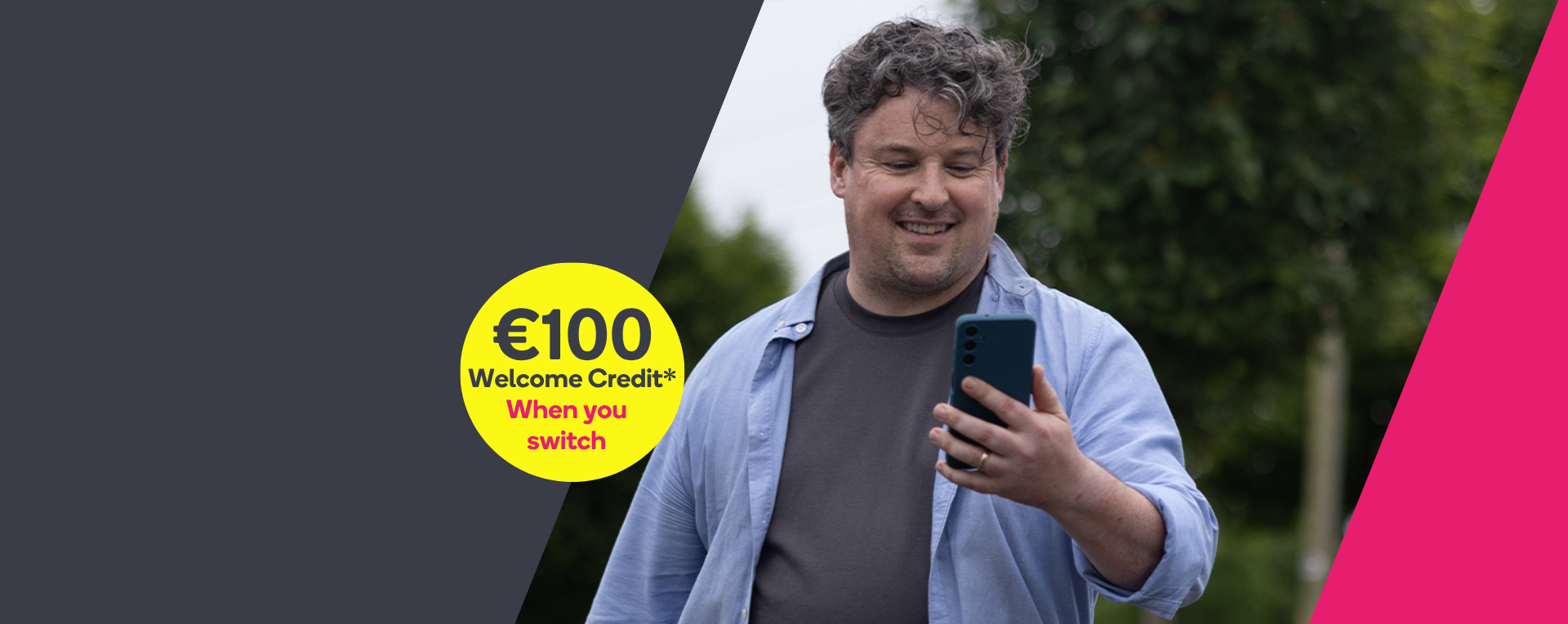 Man smiling at his phone 